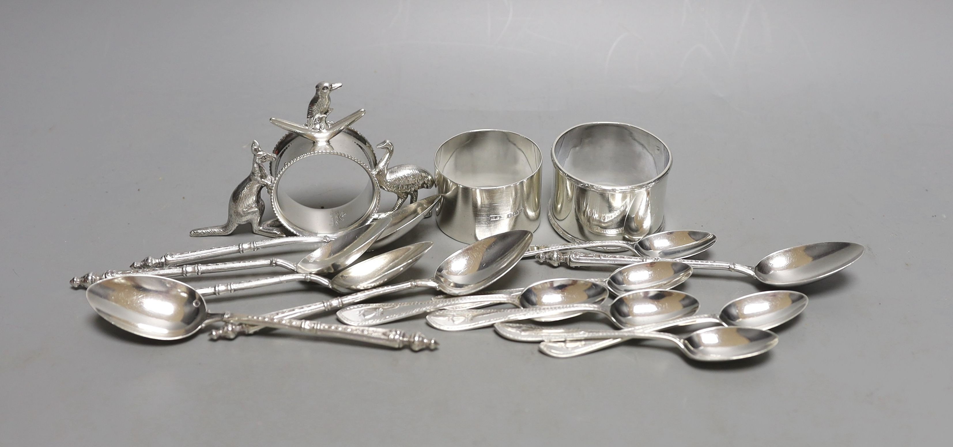 A set of six late Victorian silver coffee spoons, Sheffield, 1884, a set of six early 20th century French white metal teaspoons, two silver napkin rings and an Australian E.P.N.S. napkin ring.